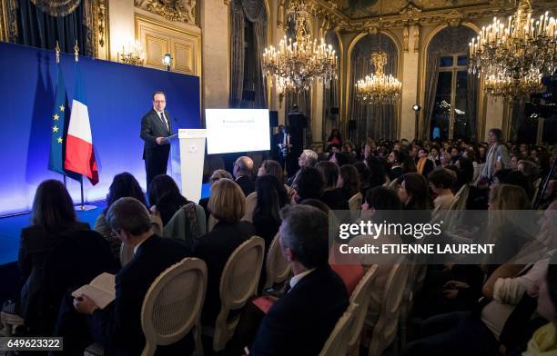 French President Francois Hollande delivers a speech during a meeting as part of the 40th International Women's Day on March 8 at the French Foreign...