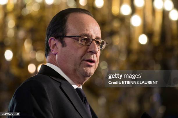 French President Francois Hollande delivers a speech during a meeting as part of the 40th International Women's Day on March 8 at the French Foreign...