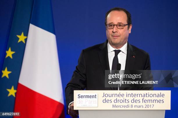 French President Francois Hollande delivers a speech during a meeting as part of the 40th International Women's Day on March 8 at the French Foreign...