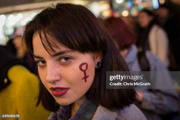 Woman attends a march down Istanbul's famous Istiklal street during a rally for International Women's Day on March 8, 2017 in Istanbul, Turkey. Women...