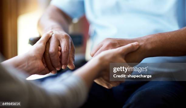 providing comfort in the time of need - caring hands stock pictures, royalty-free photos & images