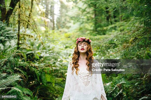 caucasian woman wearing flower crown in forest - bainbridge island wa stock pictures, royalty-free photos & images