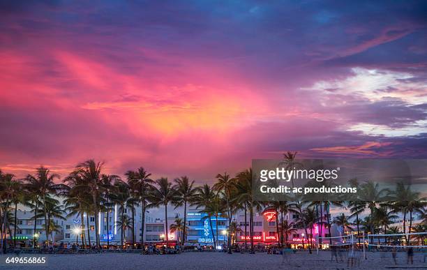 beachfront buildings under sunset sky - miami sky fotografías e imágenes de stock