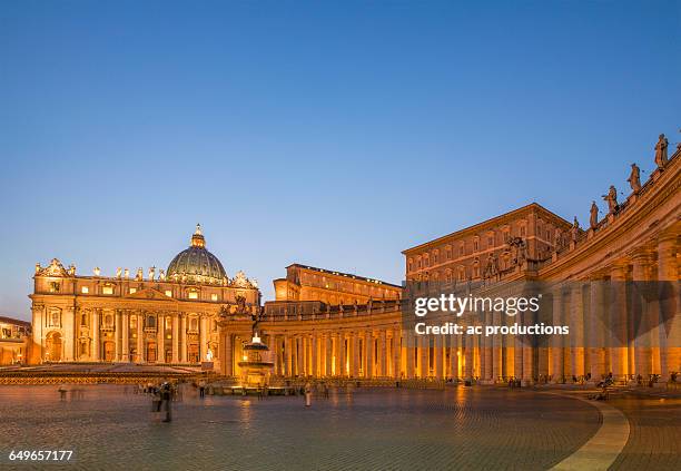 saint peter basilica at the vatican illuminated at night, rome, lazio, italy - vatican stockfoto's en -beelden