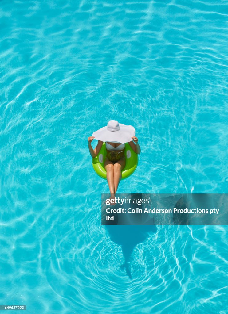 Woman Floating In Pool Pacific Islander Woman Floating In Swimming Pool High-Res Stock Photo ...
