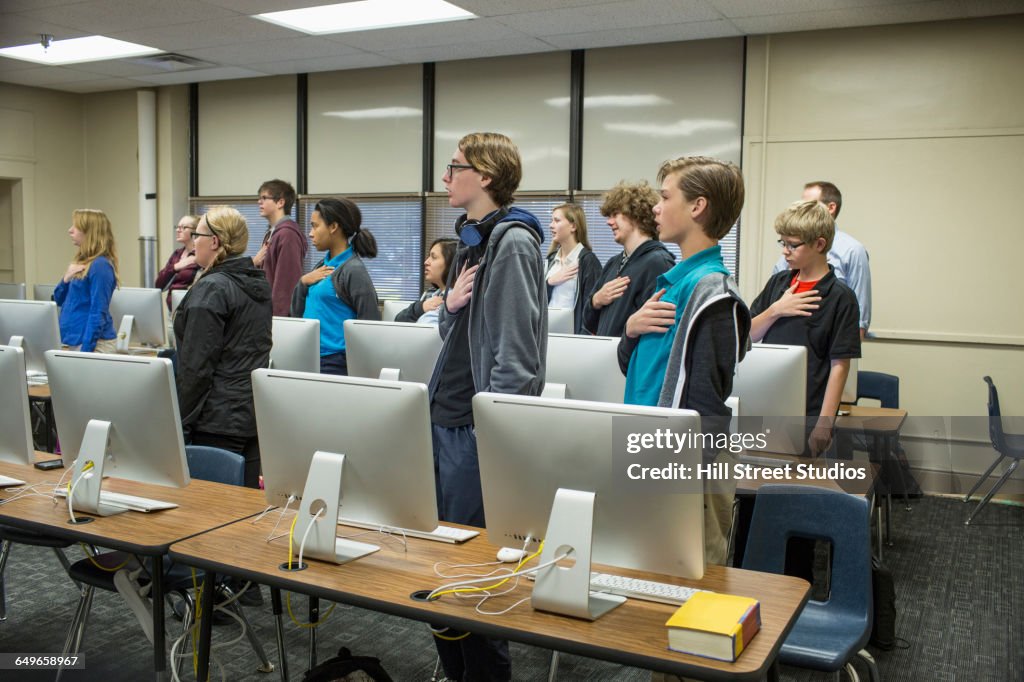 Students reciting Pledge of Allegiance in classroom