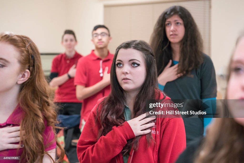Students reciting Pledge of Allegiance in classroom