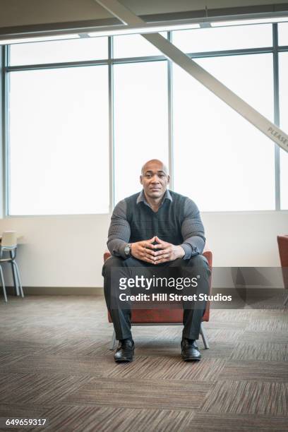 black businessman sitting in office lounge - chaise lounge bildbanksfoton och bilder