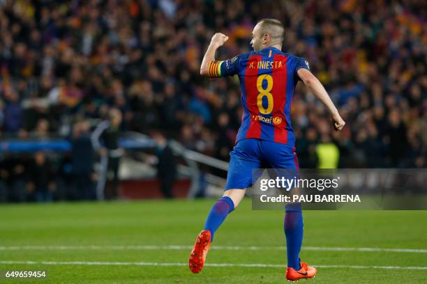 Barcelona's midfielder Andres Iniesta celebrates Paris Saint-Germain's own goal during the UEFA Champions League round of 16 second leg football...