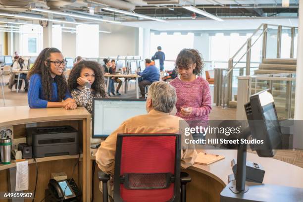 Library People Help Librarian Desk Photos and Premium High Res Pictures - Getty Images