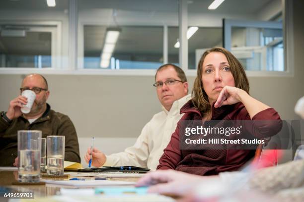 business people listening in office meeting - bores stock pictures, royalty-free photos & images