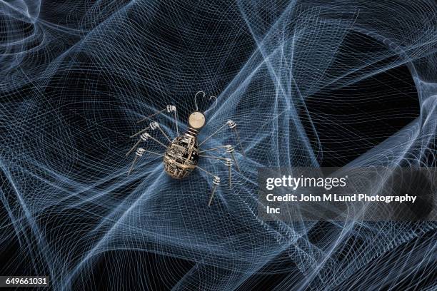 spider crawling in web of light streams - computer failure stock pictures, royalty-free photos & images