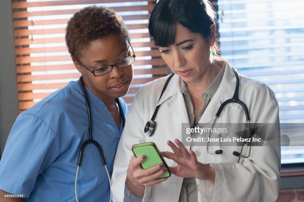 Doctors Ringing Phone Doctors Using Cell Phone In Hospital High-Res Stock Photo - Getty Images