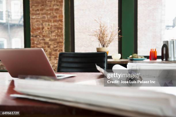 blueprints on office conference table - rolled up plans stock pictures, royalty-free photos & images