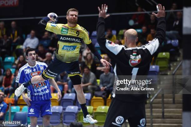 Goalkeeper Jose Manuel Sierra of Szeged is challenged by Gudjon Valur Sigurdsson of Rhein-Neckar Loewen during the EHF Champions League match between...