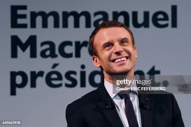 French presidential election candidate for the En Marche movement Emmanuel Macron smiles during an event organised by the collective "Elles Marchent"...