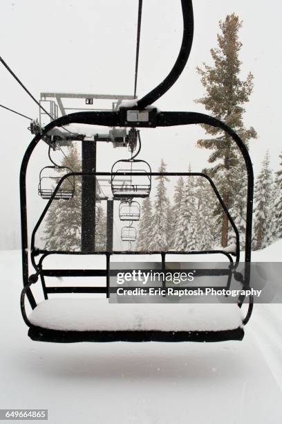 empty ski lift on snowy mountainside - ski lift isolated stock pictures, royalty-free photos & images
