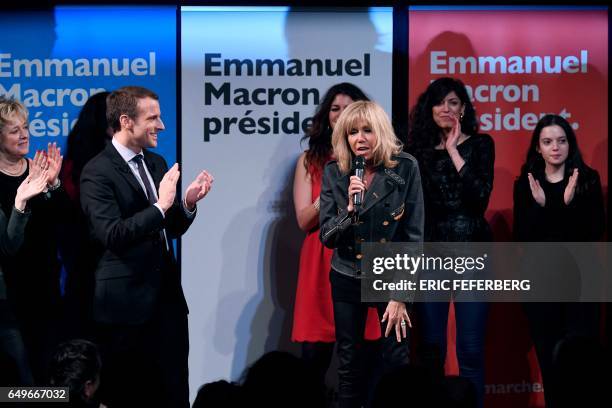 French presidential election candidate for the En Marche movement Emmanuel Macron and his wife Brigitte Trogneux attend an event organised by the...