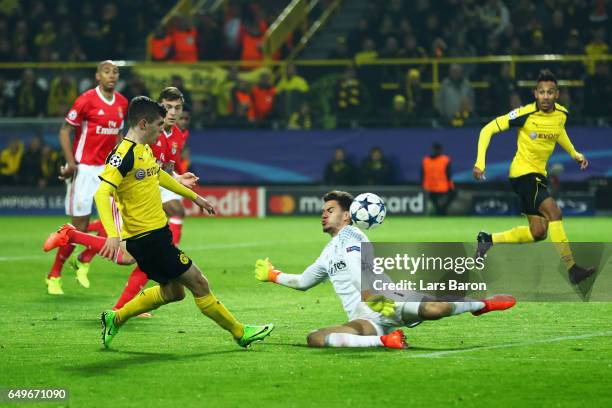 Christian Pulisic of Borussia Dortmund shoots and scores hot teams second goal during the UEFA Champions League Round of 16 second leg match between...