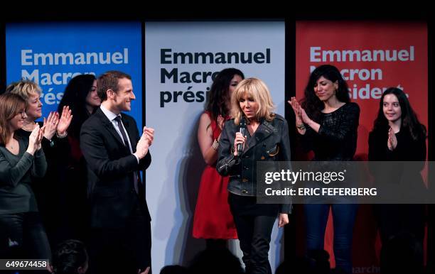 French presidential election candidate for the En Marche movement Emmanuel Macron and his wife Brigitte Trogneux attend an event organised by the...