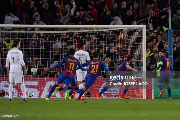 Barcelona's midfielder Sergi Roberto celebrates their victory goal during the UEFA Champions League round of 16 second leg football match FC...