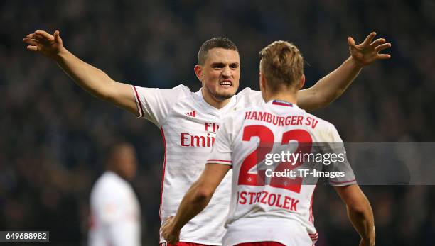 Matthias Ostrzolek of Hamburg and Kyriakos Papadopoulos of Hamburg looks on during the Bundesliga match between Hamburger SV and Hertha BSC at...