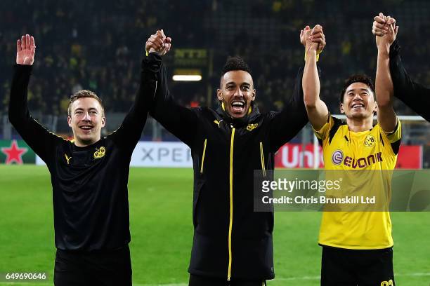Pierre-Emerick Aubameyang of Borussia Dortmund celebrates with team-mates Felix Passlack and Shinji Kagawa at the end of the UEFA Champions League...