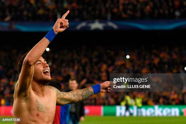 Barcelona's Brazilian forward Neymar celebrates at the end of the UEFA Champions League round of 16 second leg football match FC Barcelona vs Paris...