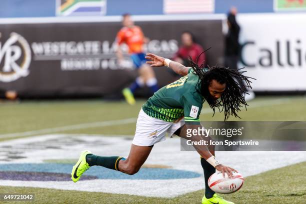 Cecil Afrika of South Africa scores during the Cup Final match between South Africa and Fiji at the HSBC Rugby Sevens Series held in Sam Boyd Stadium...