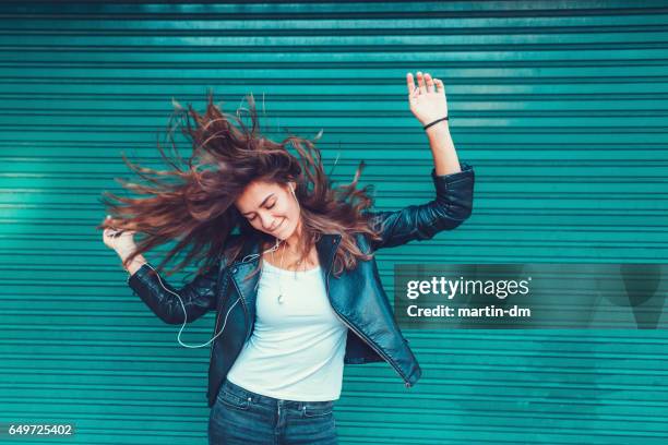 young girl dancing to the music - nodding head to music stock pictures, royalty-free photos & images