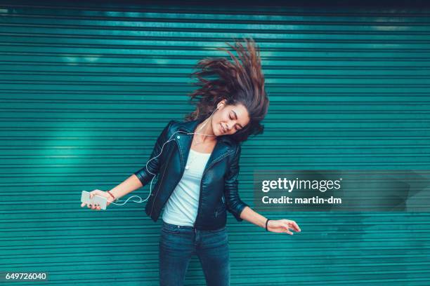 young girl dancing to the music - nodding head to music stock pictures, royalty-free photos & images