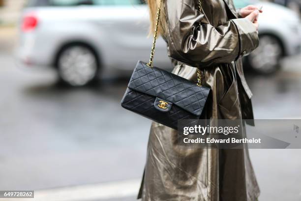 Guest wears a Chanel bag, outside the Elie Saab show, during Paris Fashion Week Womenswear Fall/Winter 2017/2018, on March 4, 2017 in Paris, France.