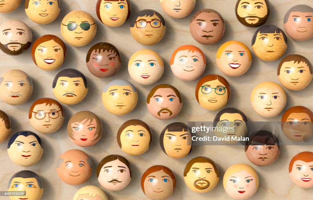 Wooden balls with multi-ethnic faces on them. (top view)
