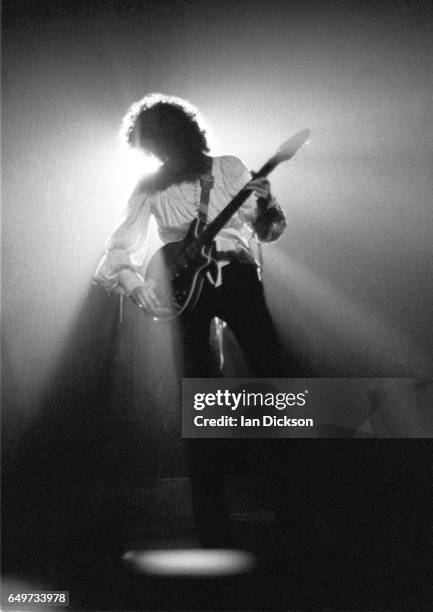 Brian May of Queen performs on stage on the 'A Night At The Opera Tour' tour, Hammersmith Odeon, London, 29 November 1975.
