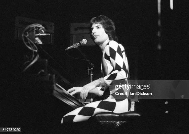 Freddie Mercury of Queen plays the piano while performing on stage on the 'A Night At The Opera Tour' tour, Hammersmith Odeon, London, 29 November...