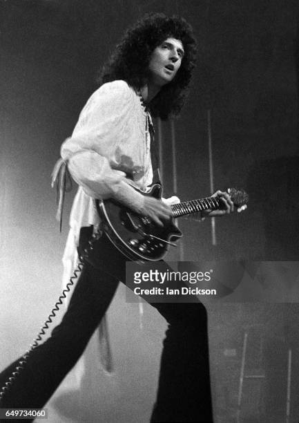 Brian May of Queen performs on stage on the 'A Night At The Opera Tour' tour, Hammersmith Odeon, London, 29 November 1975.