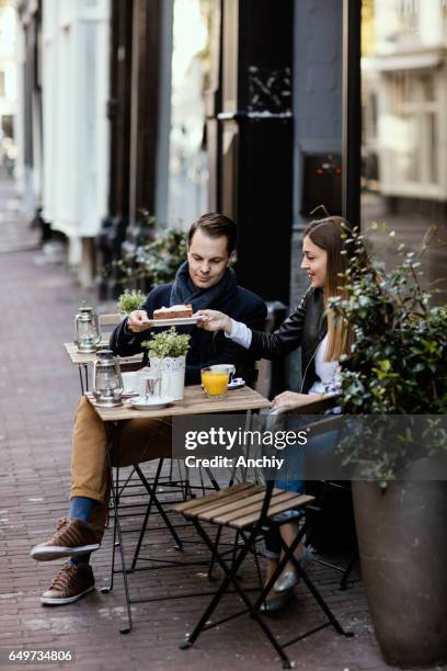 pretty couple taking a picture of themselves - amsterdam winter stock pictures, royalty-free photos & images