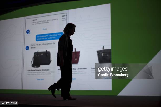 The silhouette of Diane Greene, senior vice president of cloud services at Google Inc., is seen as she walks off stage during the company's Cloud...