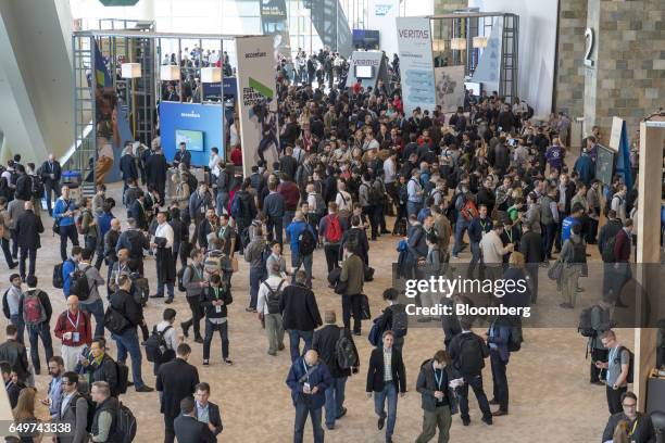 Attendees walk the halls of Moscone West during the Google Inc. Cloud Next '17 event in San Francisco, California, U.S., on Wednesday, March 8, 2017....