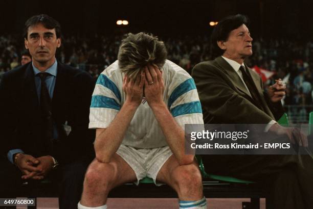 Olympic Marseilles' Chris Waddle, on the bench with Raymond Goethals , looking very upset after their team are beaten by Red Star Belgrade