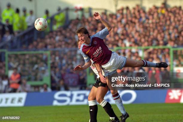 Aston Villa's Stuart Gray heads the ball away under pressure from Craig Ramage, Derby County