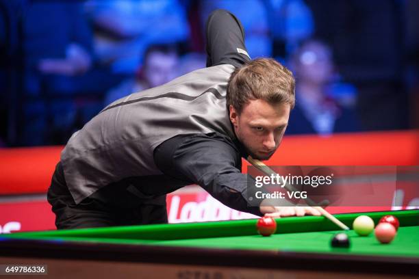 Judd Trump of England plays a shot during the first round match against Ronnie O'Sullivan of England on day three of 2017 Ladbrokes Players...