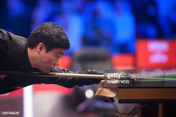 Ding Junhui of China plays a shot during the first round match against John Higgins of Scotland on day three of 2017 Ladbrokes Players Championship...