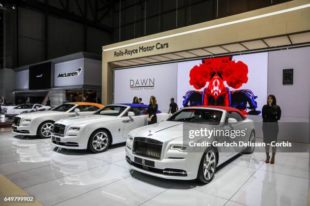 Three Rolls Royce Dawn Cars on display during the second press day of the Geneva Motor Show 2017 at the Geneva Palexpo on March 8, 2017 in Geneva,...