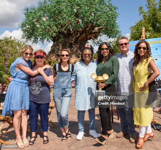 In this handout photo provided by Disney Resorts, hosts Sara Haines, Joy Behar, Jedediah Bila, Whoopi Goldberg and Sunny Hostin pose with guests,...