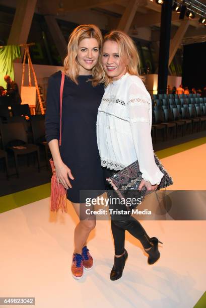 German actress Nina Bott and german moderator Nova Meierhenrich attend the Tchibo 'Ready for the Green Carpet' Fashion Show on March 8, 2017 in...