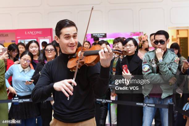 English violinist Charlie Siem performs at a shopping mall on International Women's Day on March 8, 2017 in Nanjing, Jiangsu Province of China.