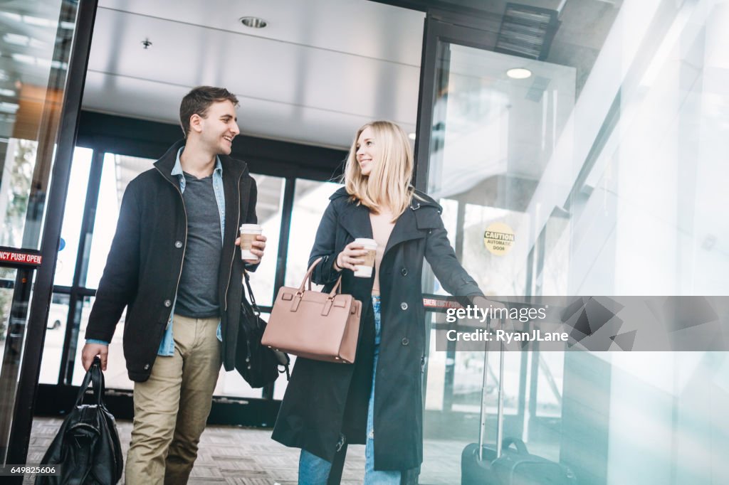 Couple Arriving at Airport Terminal