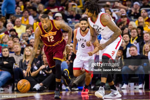 Jordan McRae of the Cleveland Cavaliers drives down court while under pressure from Lucas Nogueira of the Toronto Raptors during the second half at...