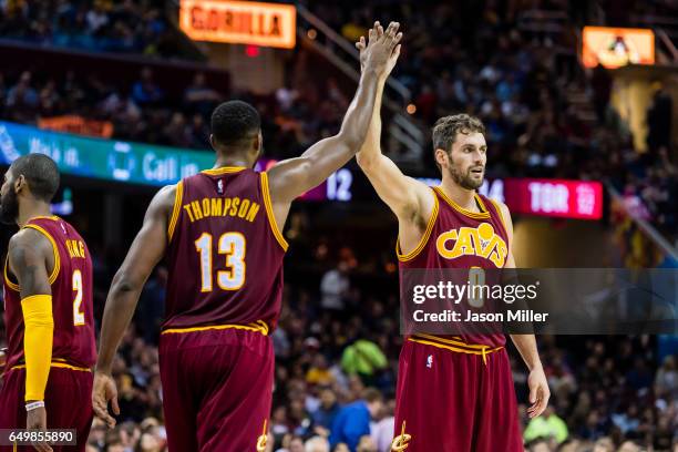 Tristan Thompson of the Cleveland Cavaliers and Kevin Love celebrate after scoring during the second half against the Toronto Raptors at Quicken...